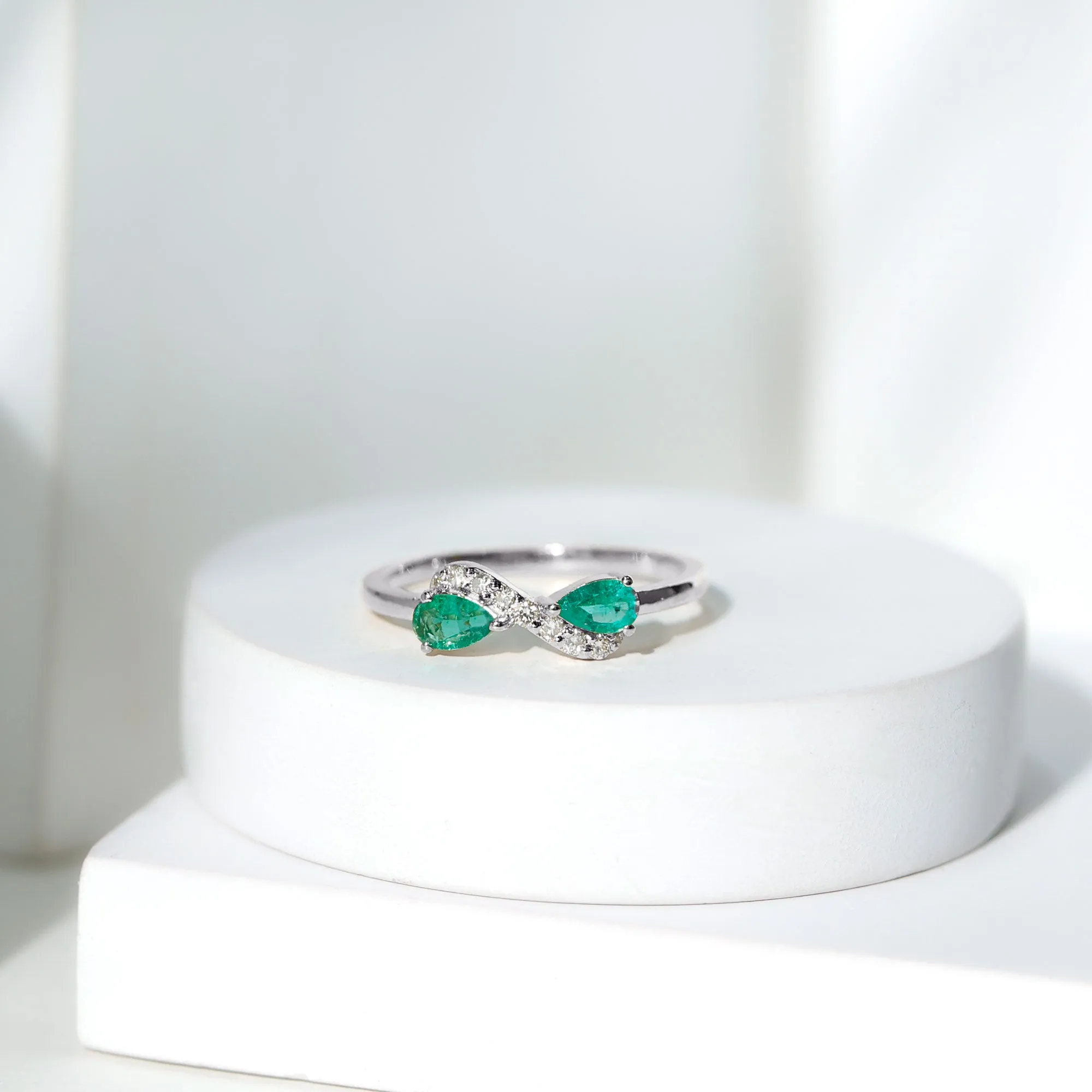 1/2 CT Pear Cut Emerald and Diamond Infinity Promise Ring