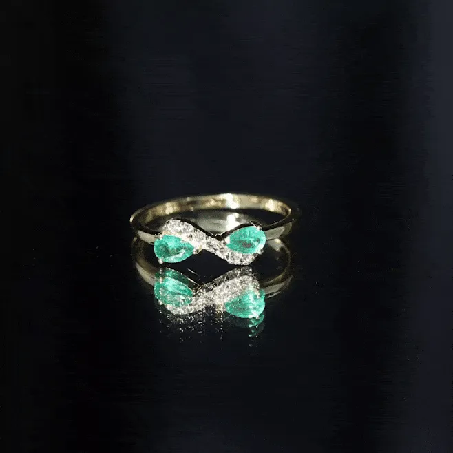 1/2 CT Pear Cut Emerald and Diamond Infinity Promise Ring