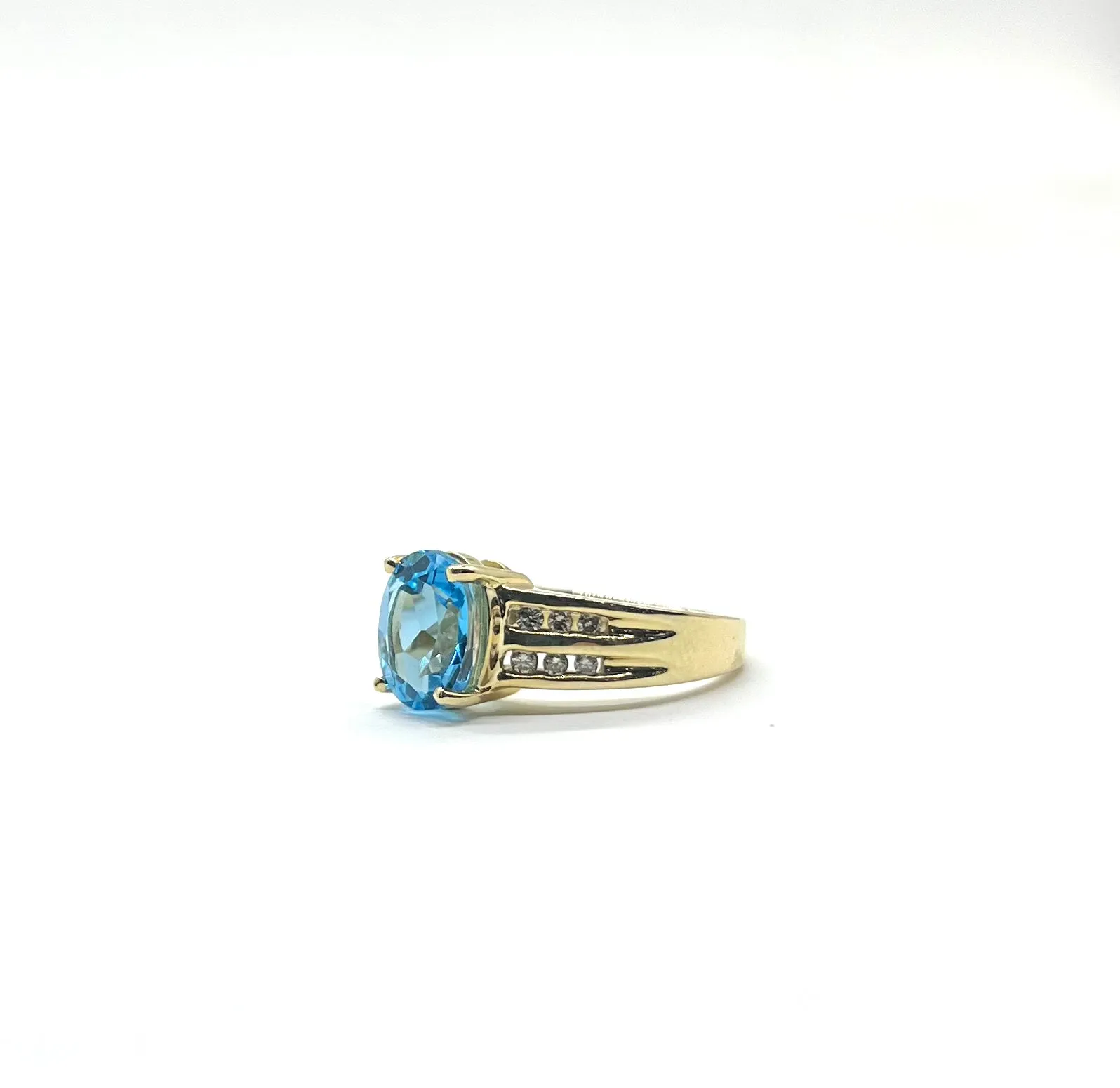 Blue Topaz Ring with Channel Set Diamonds