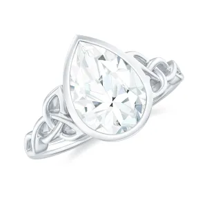 Pear Shape Moissanite Solitaire Celtic Knot Ring in Bezel Setting